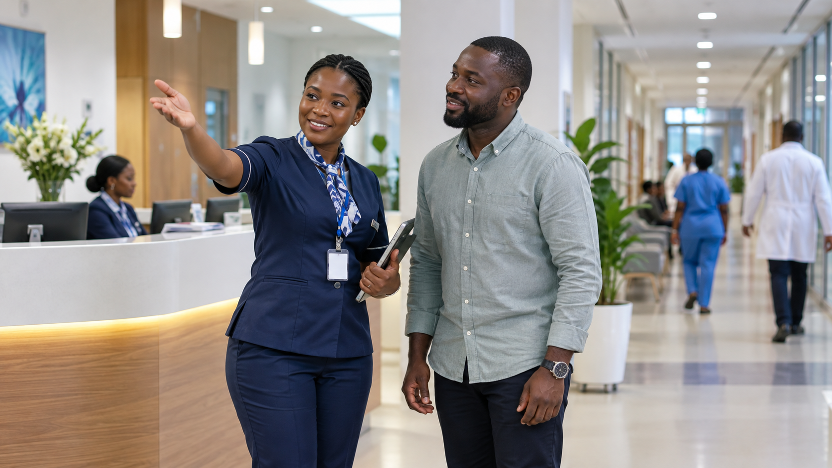 Hospital support staff helping a visitor navigate the facility